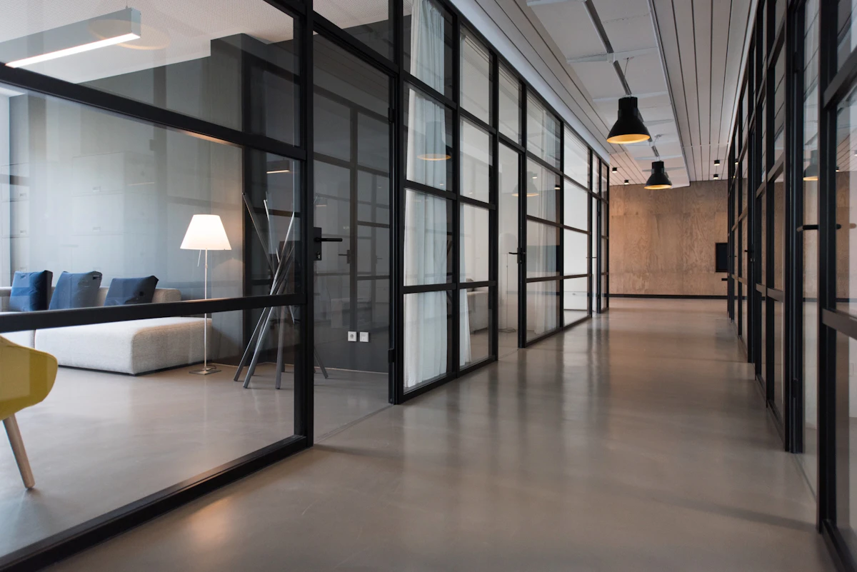 Commercial office interior with meeting tables and shared work areas