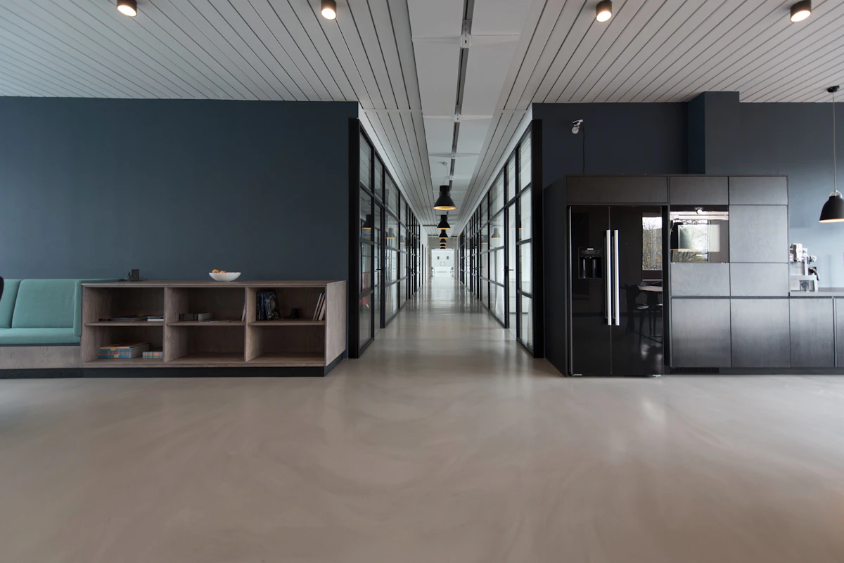 Well-maintained open-plan office with desks, meeting areas, and large windows